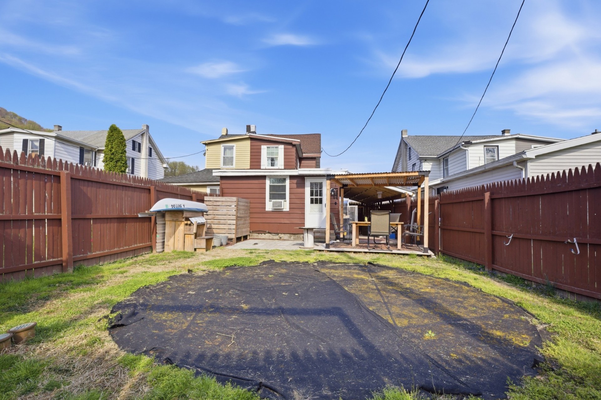 Fenced outdoor space looking toward 23 Seyfert Drive